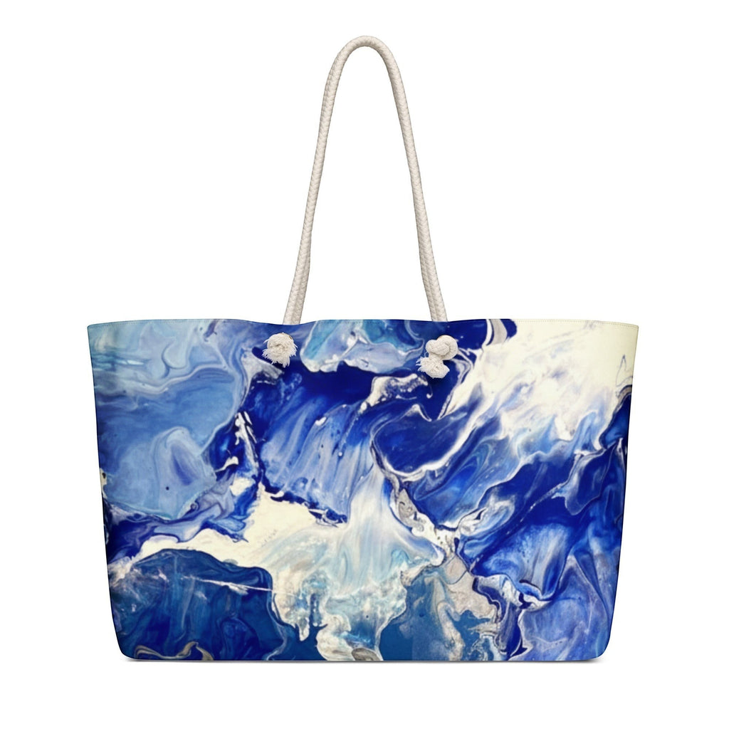 My Store weekender bag with blue and white abstract print, cream rope handles, 100% spun polyester exterior.